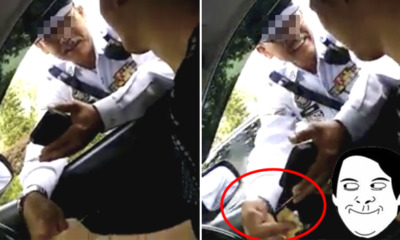 Malaysian Policeman Caught Red Handed for Accepting Bribery From Traffic Offender - World Of Buzz 2