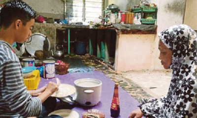 Malaysian Teen Refuses to Go to School to Take Care of Blind Grandmother - WORLD OF BUZZ 1