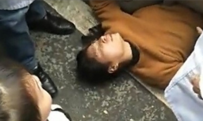 Wife Demands Traffic Police To Let Husband Go By Laying Under Police Car - WORLD OF BUZZ