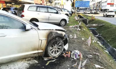 Luxury Car Damaged After Owner Unknowingly Parked  at the Spot Where Joss Paper Was Burning - WORLD OF BUZZ
