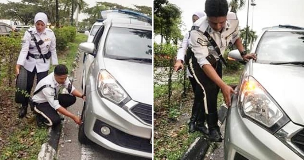 Traffic Police Officers Helped Prevent A Major Jam After Helping Driver Change Tyre - WORLD OF BUZZ 1