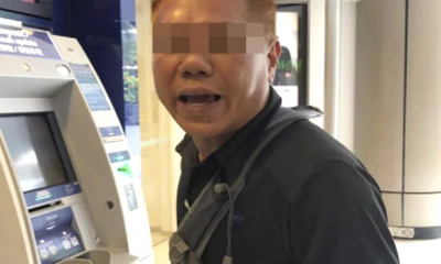 Woman Tries To Deposit 6 Bundles Of Cash At ATM For 25 Minutes, Get Scolded By Man - WORLD OF BUZZ