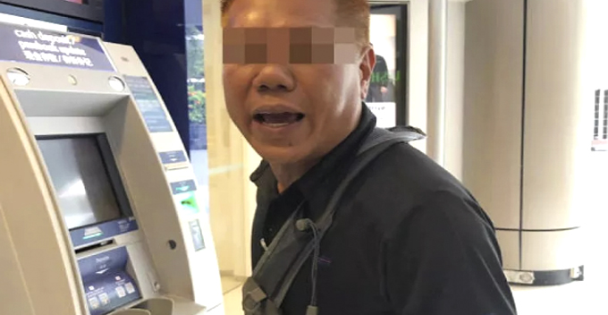 Woman Tries To Deposit 6 Bundles Of Cash At ATM For 25 Minutes, Get Scolded By Man - WORLD OF BUZZ