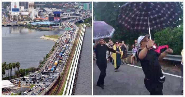 These Tourists Were Stuck on Malaysia-Singapore 2nd Link for 8Hrs, So They Started Dancing & Singing - WORLD OF BUZZ