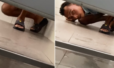 Watch: Pervert Caught Red-handed After Looking Under Toilet Door While Woman Was Inside - WORLD OF BUZZ