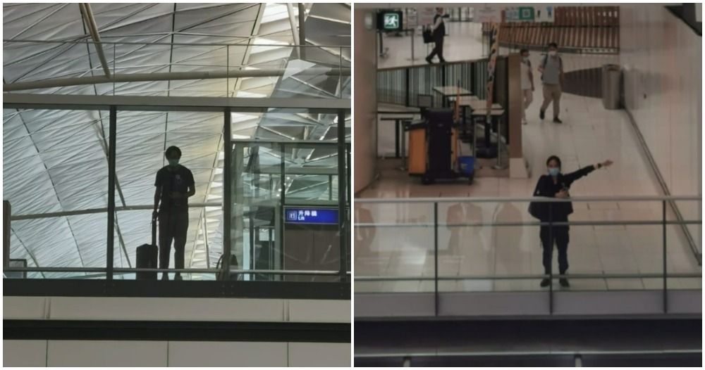 long distance couple wave to each other in airport