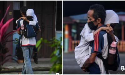 father carries daughter with ataxia to school